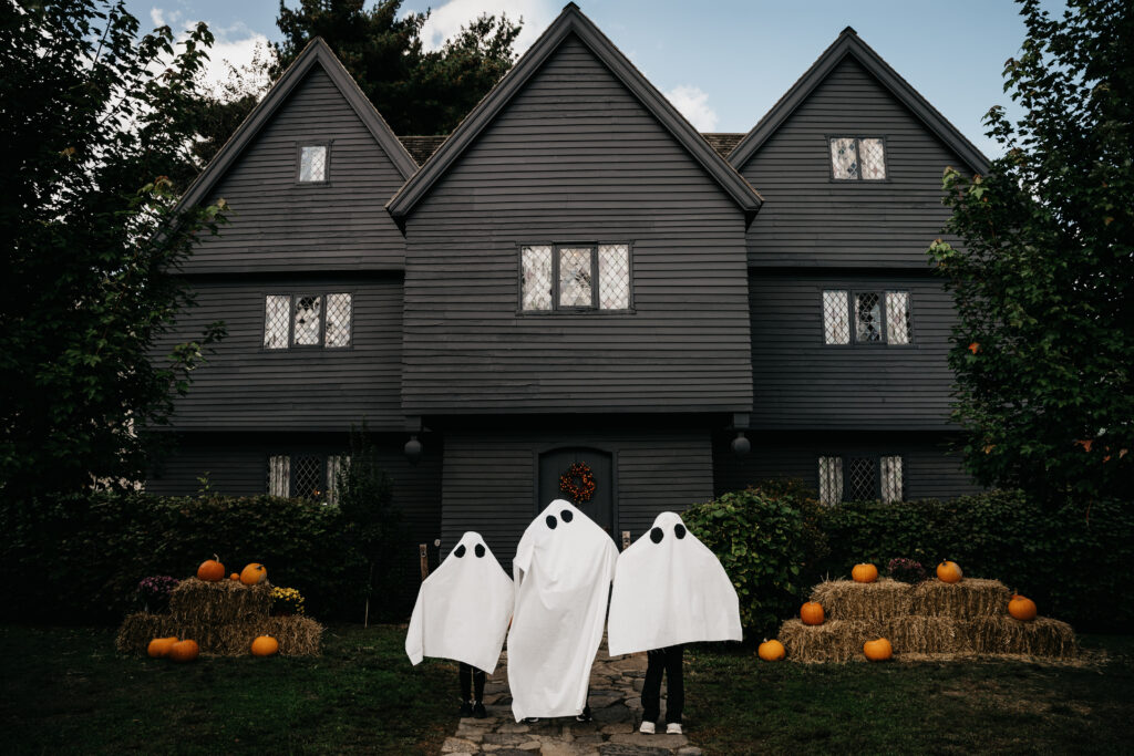 spooky downtown salem bachelorette photoshoot at witch house in ghost costumes