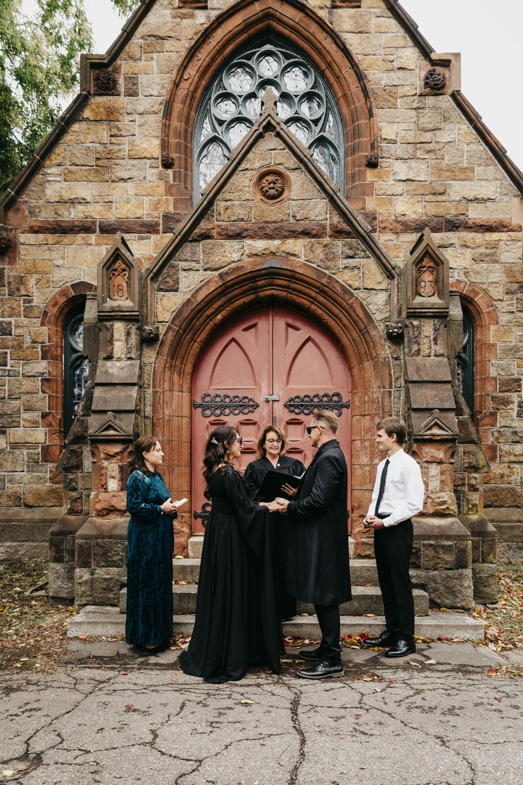 A bride and groom during their ceremony in front of the chapel at Greenlawn Cemetery in Salem Massachusetts