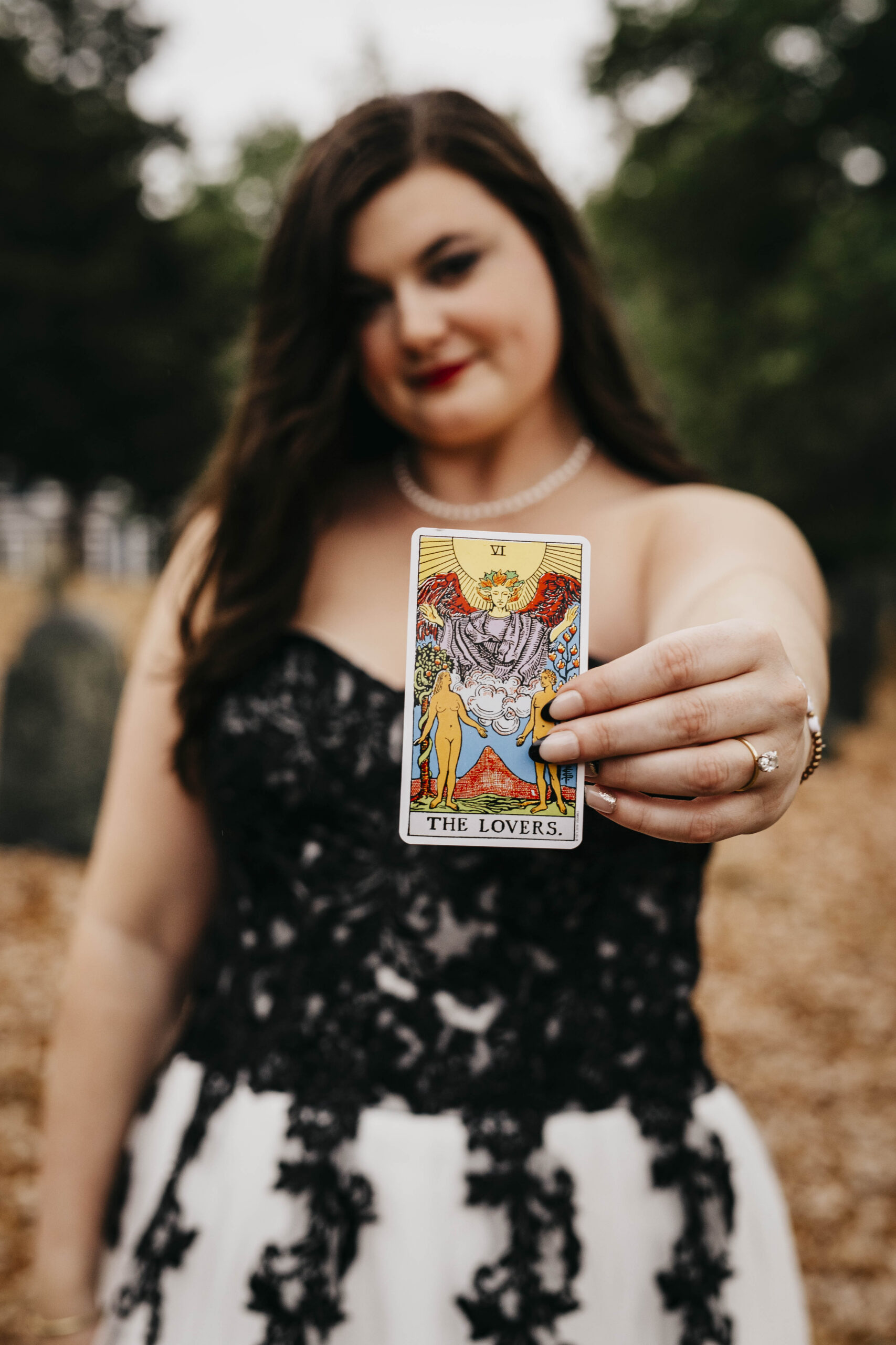 a bride with a tarot card in a cemetery in Salem massachusetts