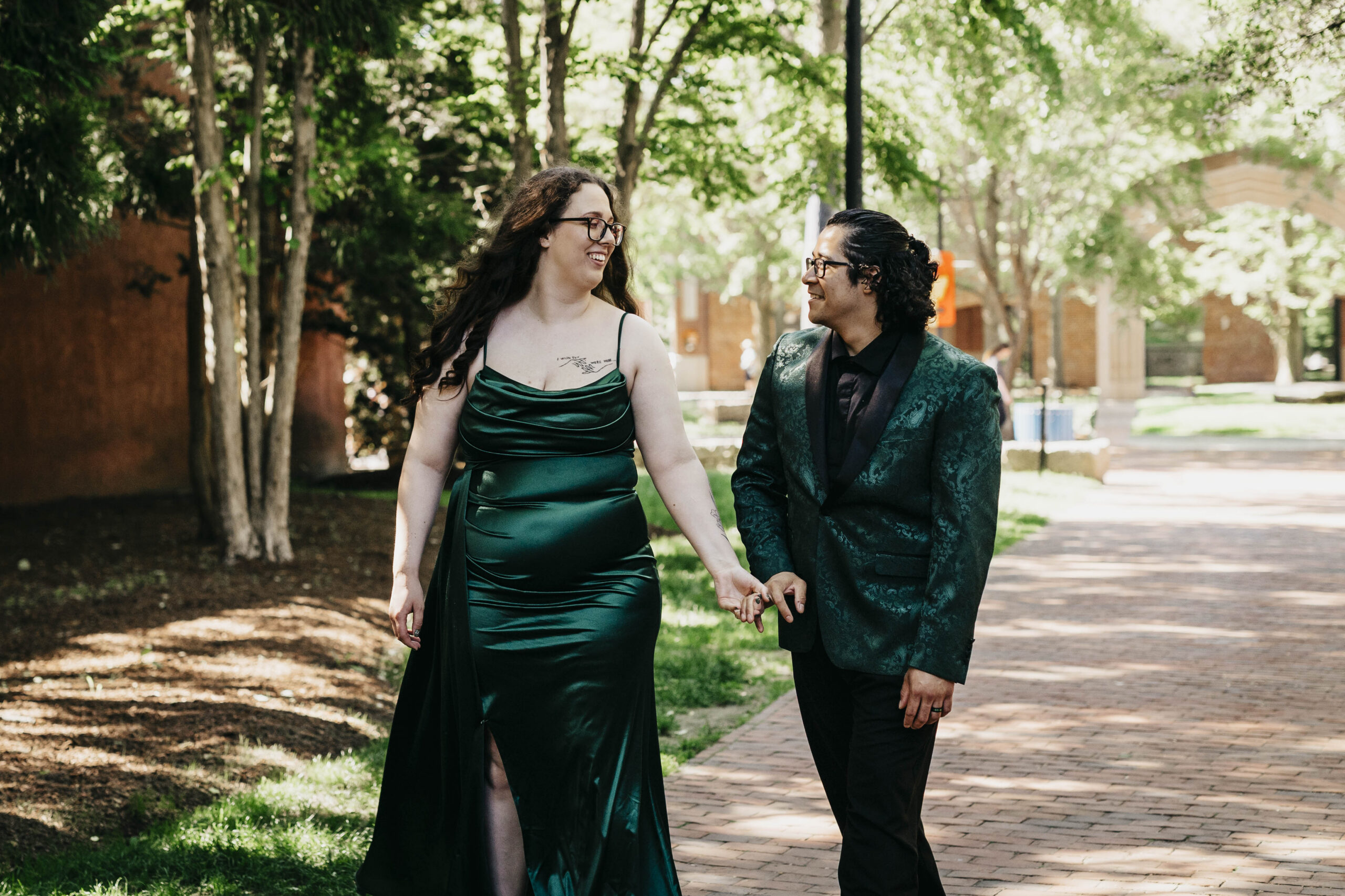 a bride and groom hold hands on a walk in Salem Massachusetts