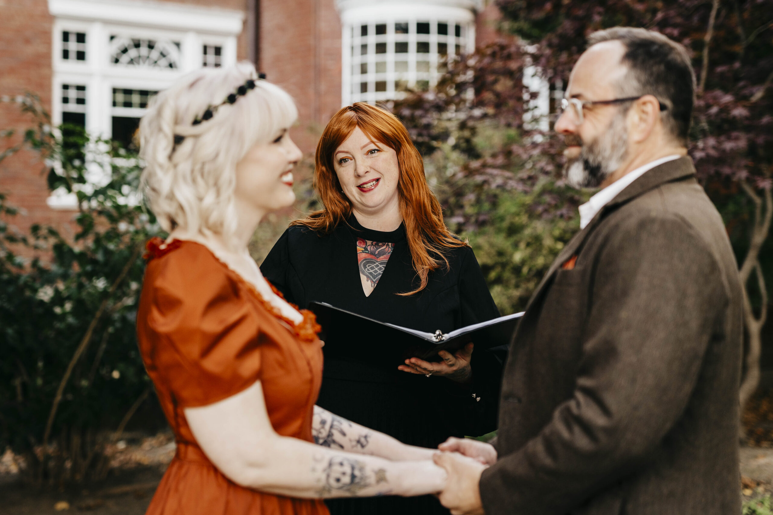 bride, groom, and officiant during wedding ceremony