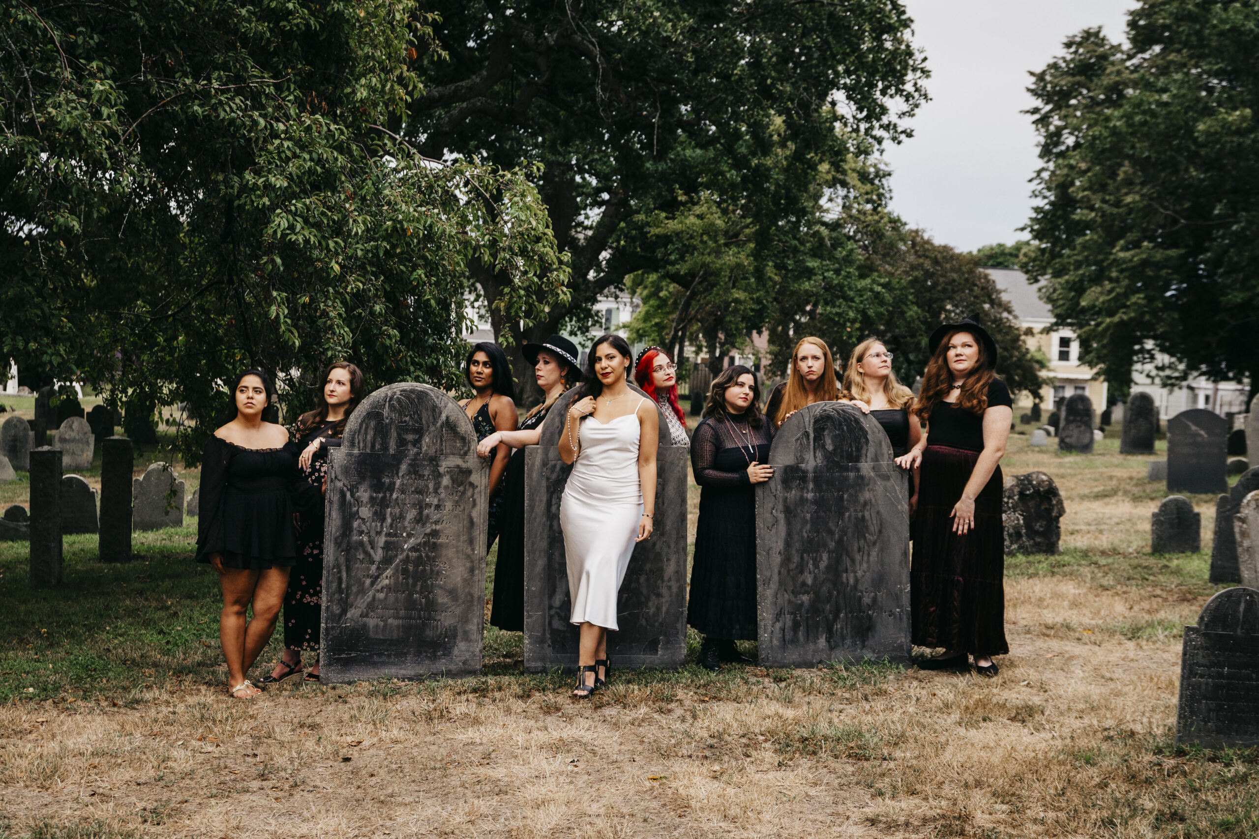 A group of girls posed at a cemetery in Salem Massachusetts